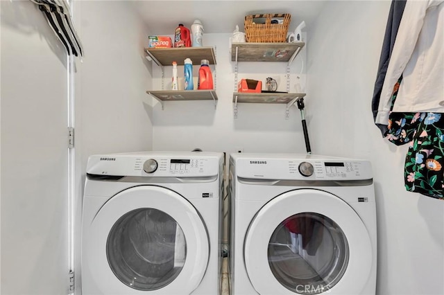 laundry room with laundry area and washer and clothes dryer