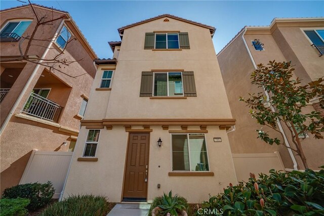 711 Banyan Way, Pomona, CA 91767 - view of front of house featuring fence and stucco siding