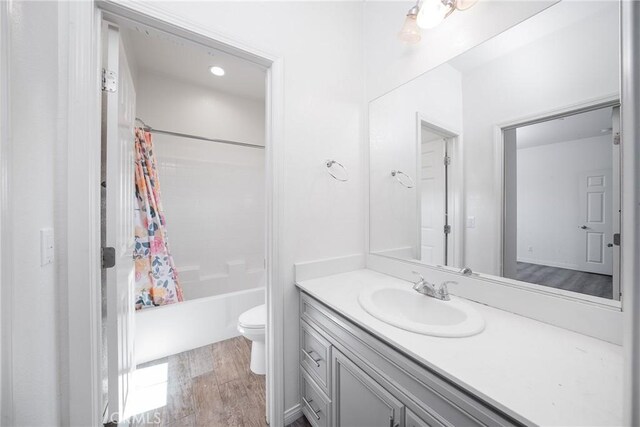 711 Banyan Way, Pomona, CA 91767 - full bathroom with shower / bath combination with curtain, vanity, toilet, and wood finished floors