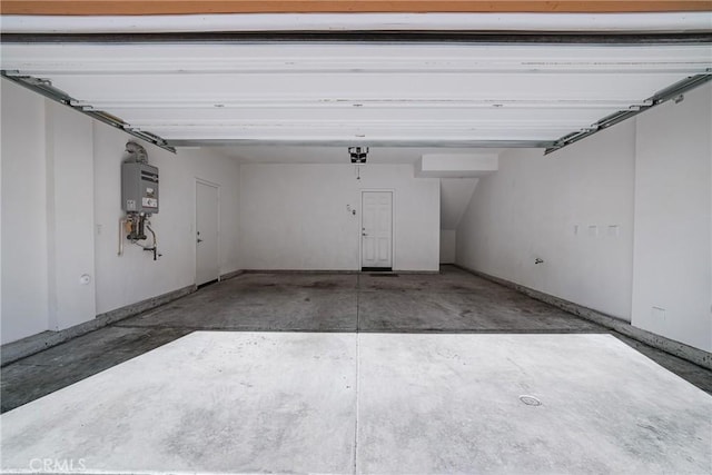 711 Banyan Way, Pomona, CA 91767 - garage featuring water heater and a garage door opener
