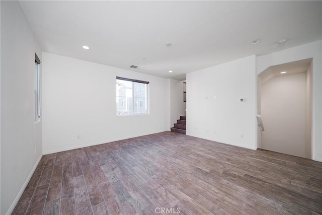 711 Banyan Way, Pomona, CA 91767 - spare room featuring stairs, recessed lighting, visible vents, and wood finished floors