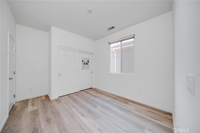 711 Banyan Way, Pomona, CA 91767 - unfurnished room with light wood-style floors, visible vents, and baseboards