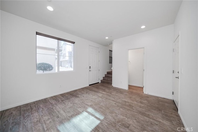 711 Banyan Way, Pomona, CA 91767 - empty room with baseboards, wood finished floors, and recessed lighting