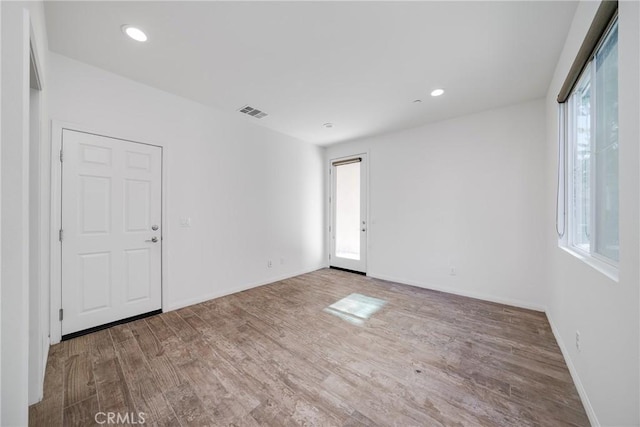 711 Banyan Way, Pomona, CA 91767 - spare room featuring baseboards, wood finished floors, and recessed lighting