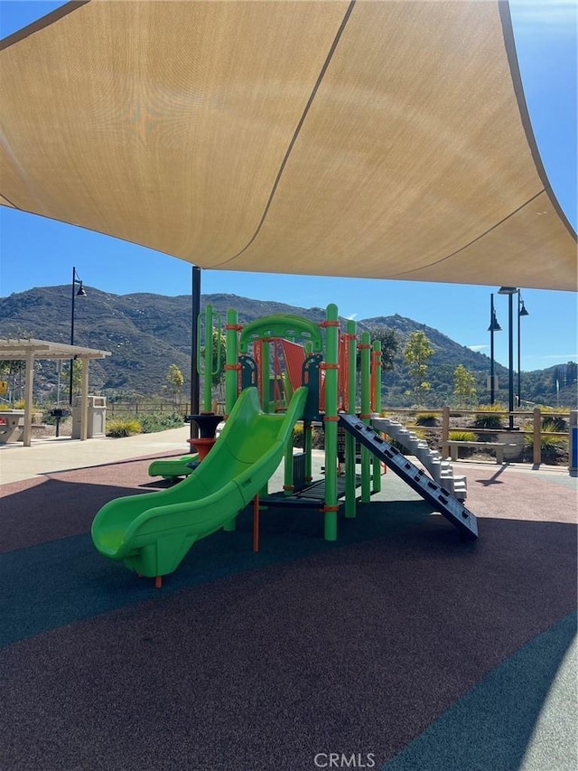 community play area with a mountain view