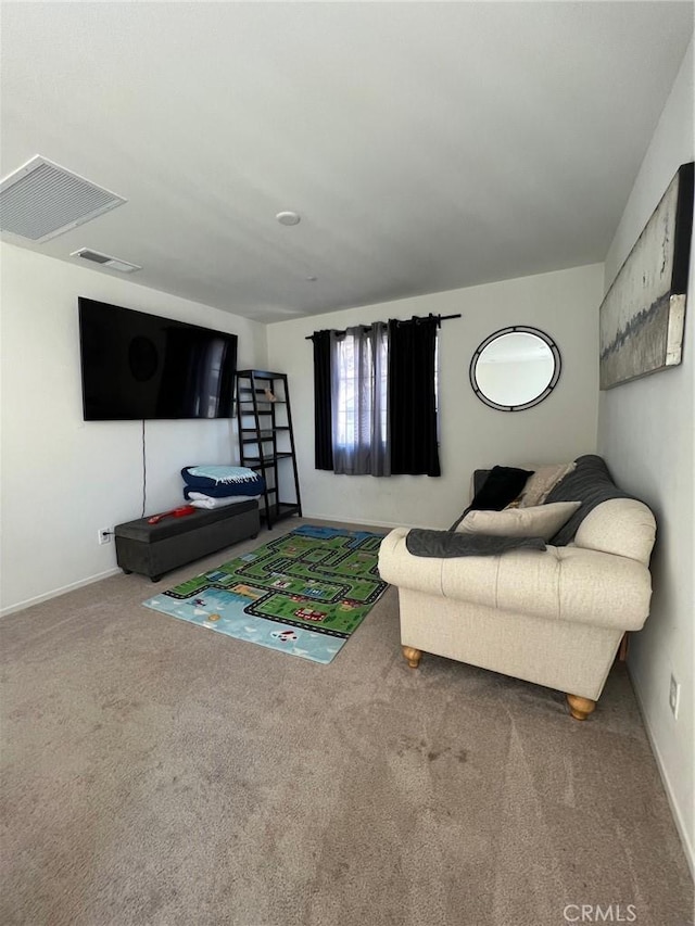 carpeted living area with baseboards and visible vents