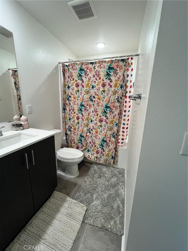 bathroom with visible vents, vanity, and toilet