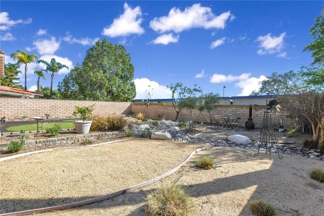 view of yard with a fenced backyard