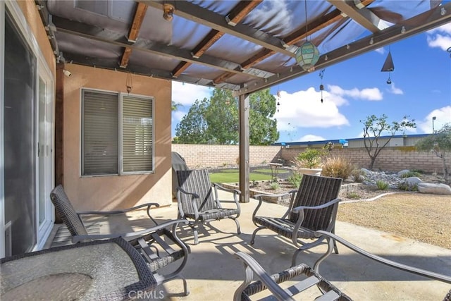 view of patio featuring a fenced backyard and a pergola