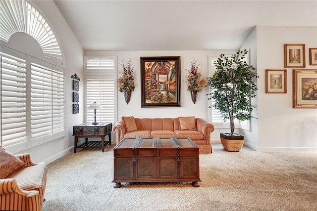 living room with light carpet and baseboards