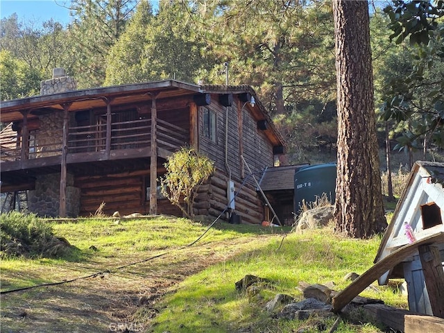 view of side of home featuring a wooden deck