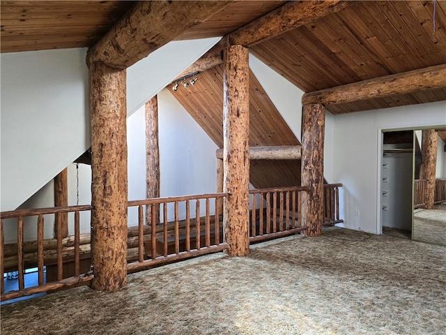 interior space featuring wood ceiling, carpet flooring, and beam ceiling