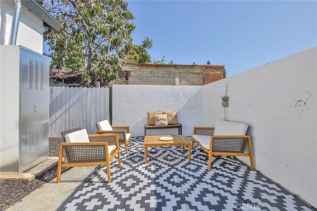 view of patio / terrace with a fenced backyard and an outdoor living space