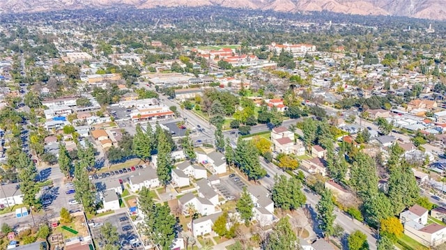 birds eye view of property featuring a mountain view and a residential view