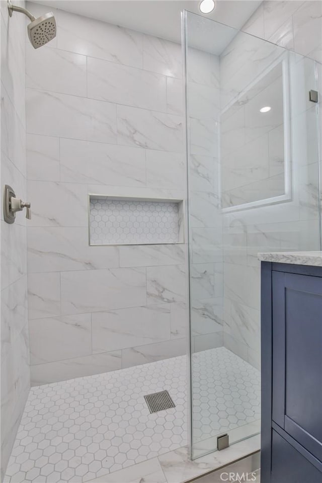 full bath with a tile shower