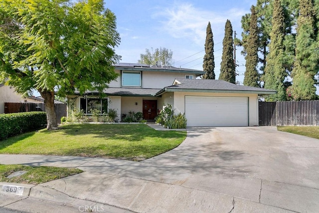 view of front of house with stucco siding, concrete driveway, an attached garage, roof mounted solar panels, and fence