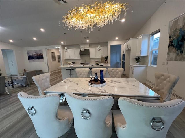 dining area featuring recessed lighting, dark wood-style flooring, and visible vents