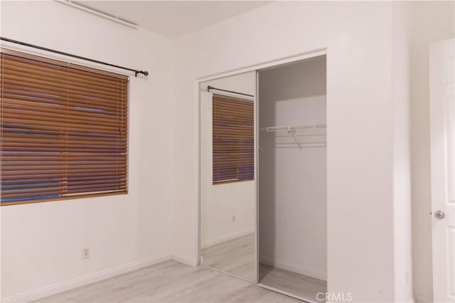 1594 Margit St, Redlands, CA 92374 - unfurnished bedroom with a closet, baseboards, and light wood-type flooring