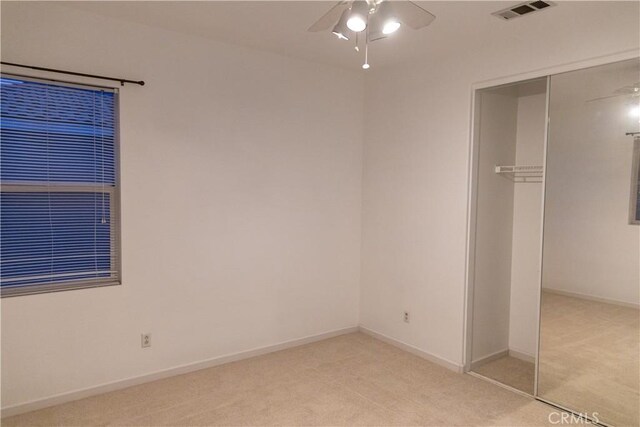 1594 Margit St, Redlands, CA 92374 - unfurnished bedroom featuring light colored carpet, visible vents, baseboards, and a closet