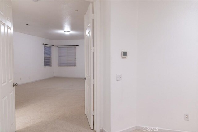 1594 Margit St, Redlands, CA 92374 - corridor with light carpet and baseboards