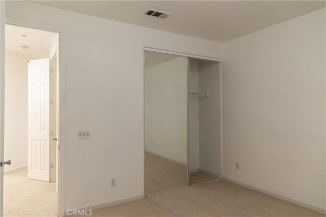 1594 Margit St, Redlands, CA 92374 - unfurnished bedroom with baseboards, visible vents, a closet, and light colored carpet