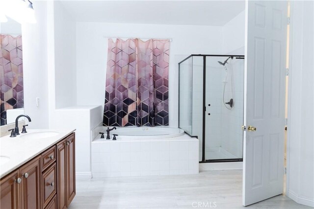 1594 Margit St, Redlands, CA 92374 - full bathroom with a stall shower, a garden tub, double vanity, and a sink