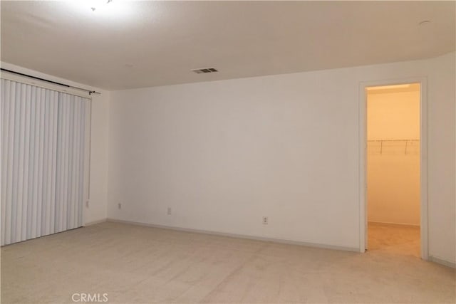 1594 Margit St, Redlands, CA 92374 - spare room with visible vents, light colored carpet, and baseboards