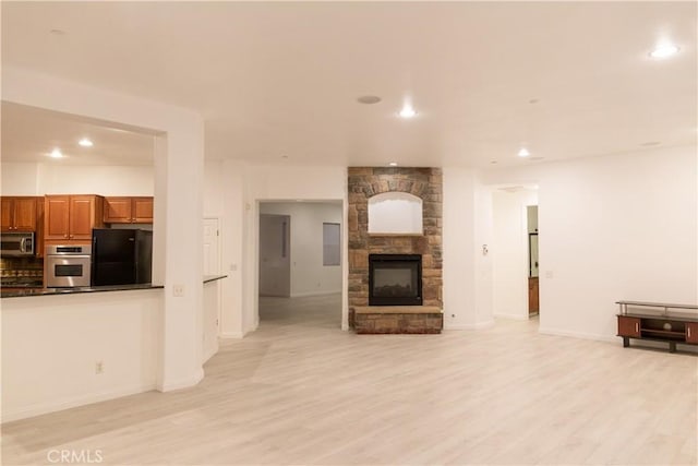 1594 Margit St, Redlands, CA 92374 - unfurnished living room with a fireplace, recessed lighting, light wood finished floors, and baseboards