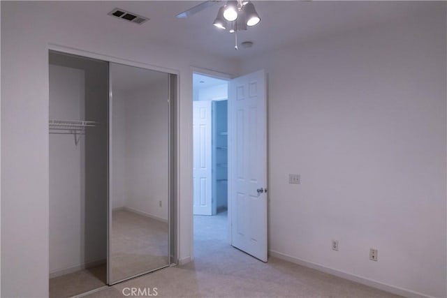 1594 Margit St, Redlands, CA 92374 - unfurnished bedroom with light colored carpet, visible vents, baseboards, and a closet