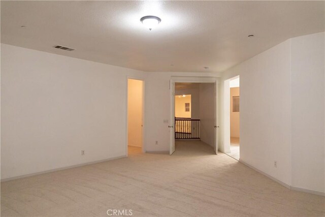 1594 Margit St, Redlands, CA 92374 - empty room with baseboards, visible vents, and light colored carpet