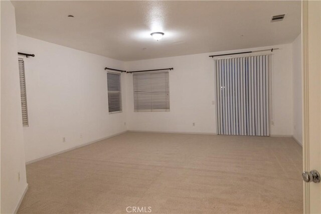 1594 Margit St, Redlands, CA 92374 - empty room featuring visible vents, light carpet, and baseboards