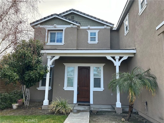 1594 Margit St, Redlands, CA 92374 - view of front facade with covered porch and stucco siding