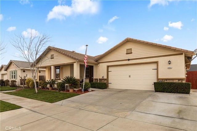 ranch-style house with an attached garage, a tiled roof, concrete driveway, and stucco siding