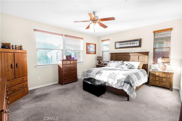 bedroom with carpet floors, ceiling fan, and baseboards