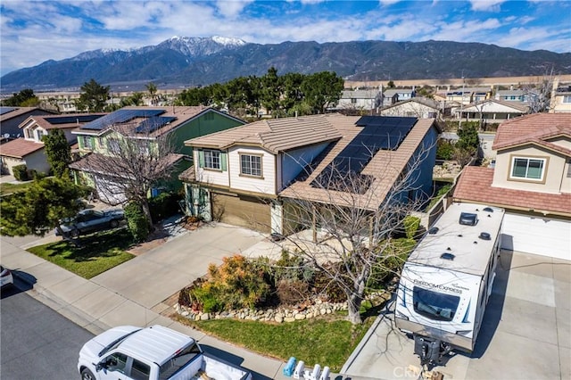 bird's eye view featuring a residential view and a mountain view