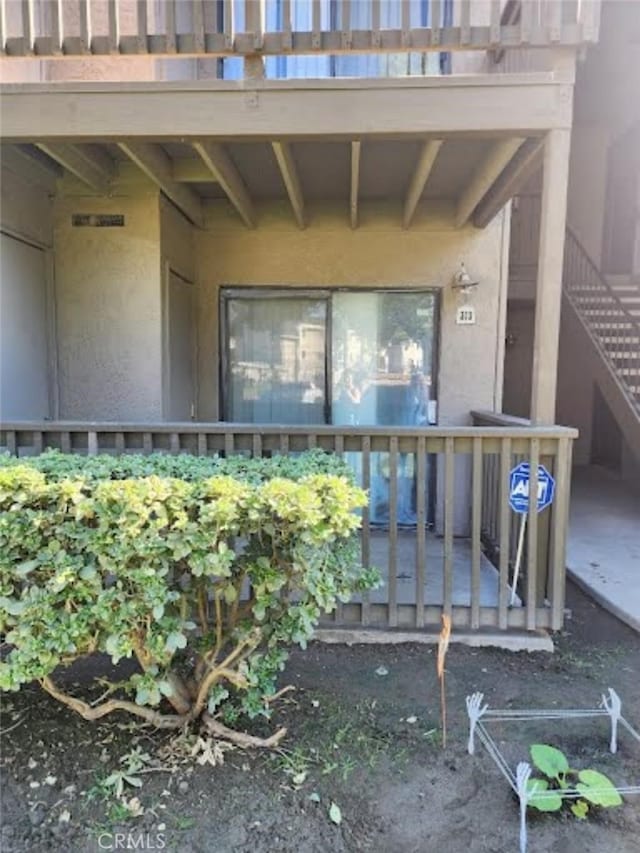 doorway to property with stucco siding