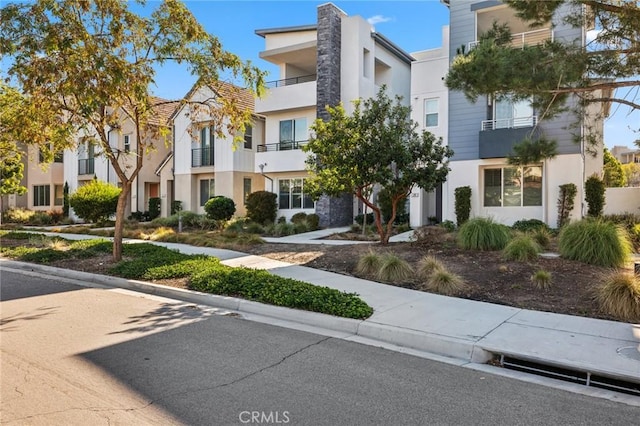 exterior space with a residential view and stucco siding