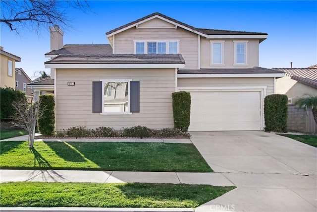 view of front of property with driveway, a front lawn, and an attached garage