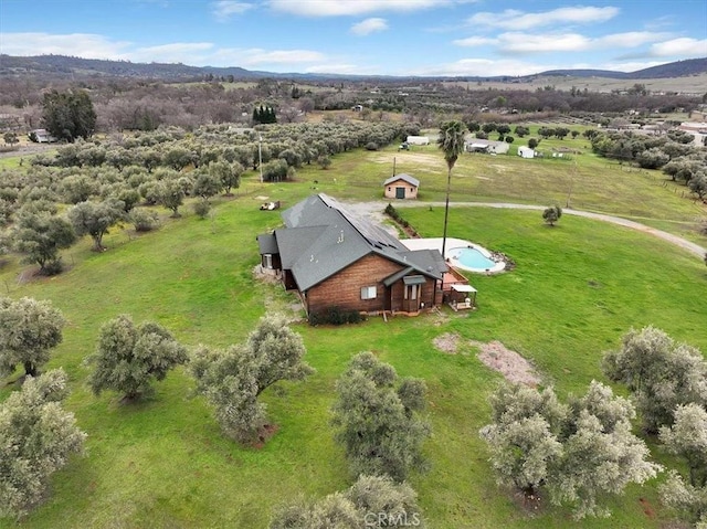 birds eye view of property with a mountain view and a rural view