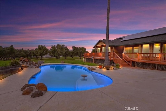 pool with a deck and a patio