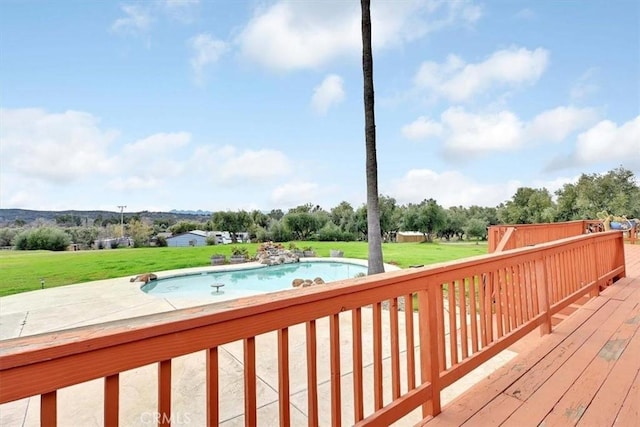 wooden terrace with a yard