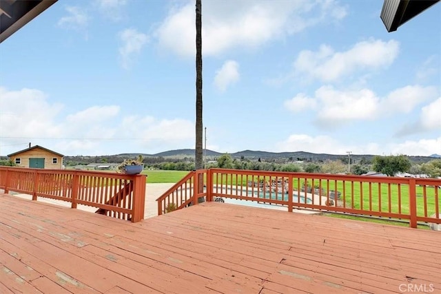 wooden deck with a mountain view