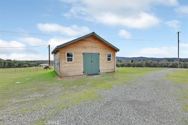 view of outbuilding featuring an outdoor structure