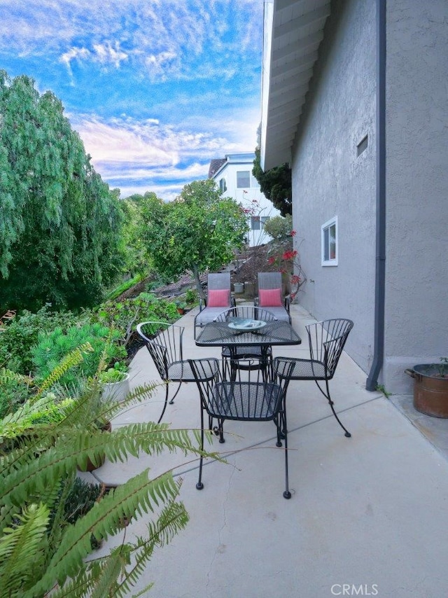 view of patio featuring outdoor dining space