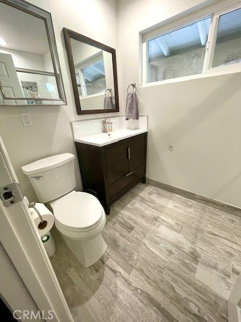 8373 Denise Ln, West Hills, CA 91304 - bathroom with vanity and wood finished floors
