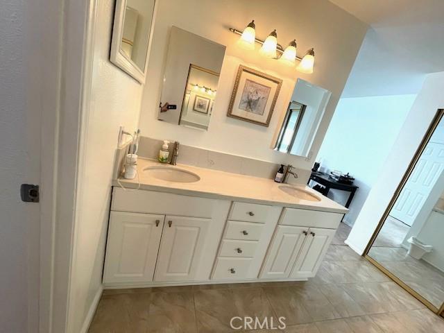 8373 Denise Ln, West Hills, CA 91304 - full bath with double vanity and tile patterned flooring
