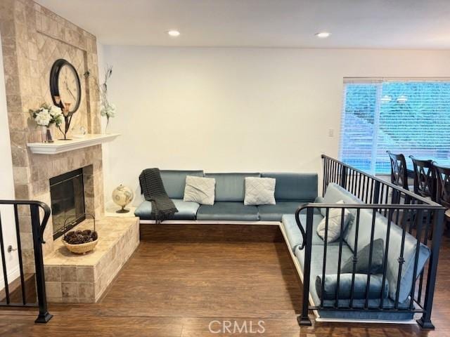 8373 Denise Ln, West Hills, CA 91304 - living room with wood finished floors, a large fireplace, and recessed lighting