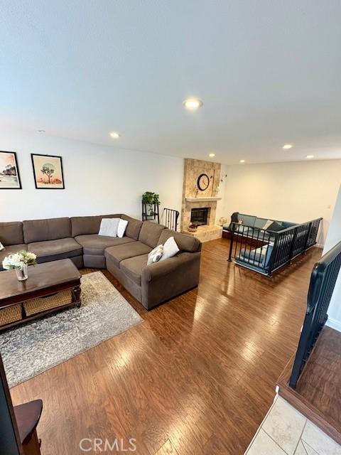 8373 Denise Ln, West Hills, CA 91304 - living room featuring a fireplace, recessed lighting, and wood finished floors