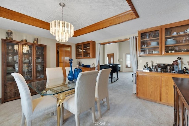 dining room with beamed ceiling, light colored carpet, and a notable chandelier