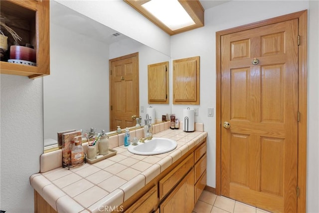 bathroom featuring tile patterned floors, visible vents, and vanity